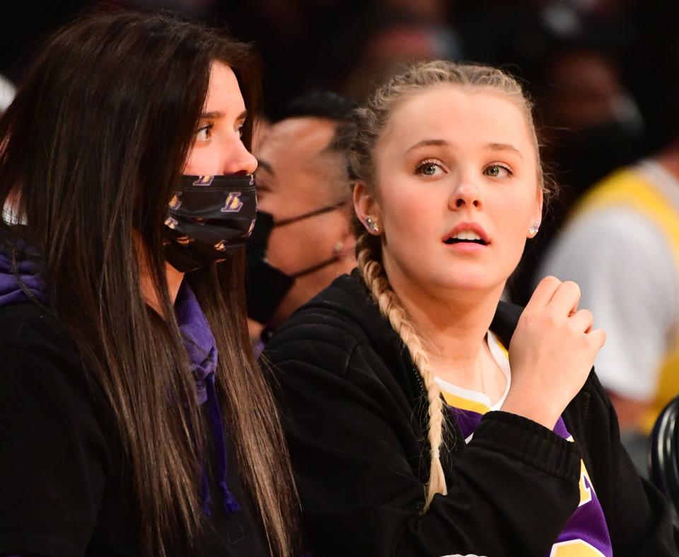 A closeup of JoJo and Katie at a basketball game