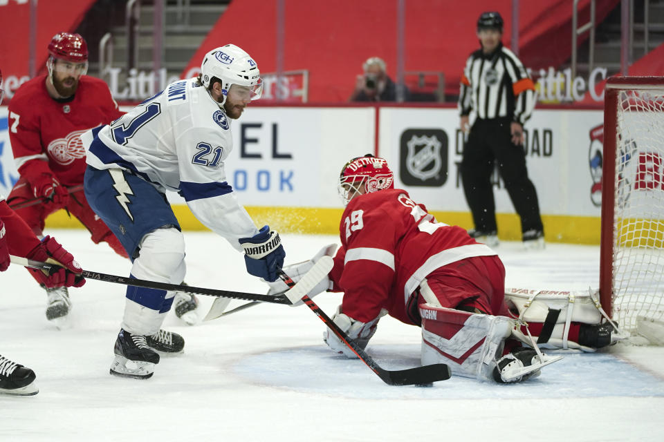 Detroit Red Wings goaltender Thomas Greiss (29) stops a Tampa Bay Lightning center Brayden Point (21) shot in the first period of an NHL hockey game Saturday, May 1, 2021, in Detroit. (AP Photo/Paul Sancya)