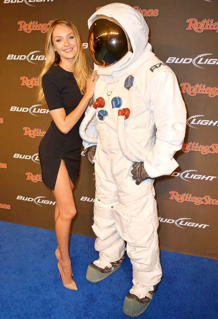 Model Candice Swanepoel cozied up to an Axe astronaut on the Bud Light blue carpet. (2/1/13)