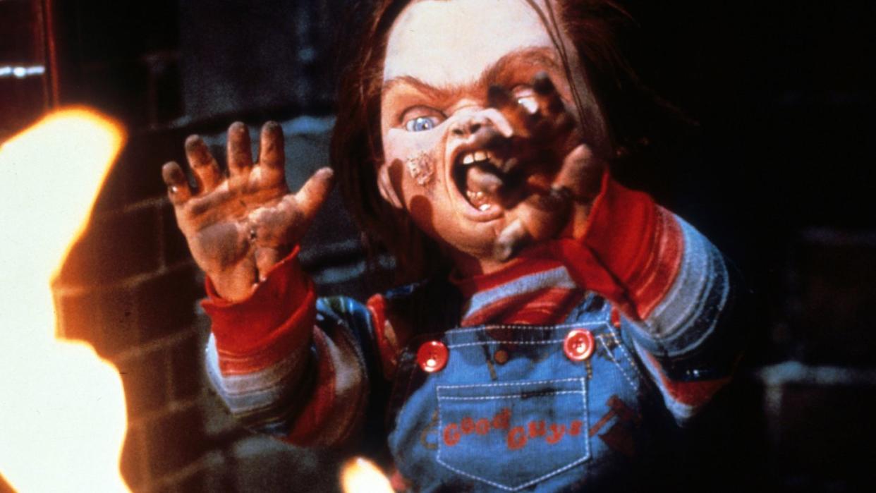 chucky attacks in a scene from child's play a good housekeeping pick for best halloween movies