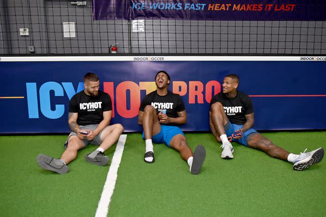 <p>Denise Truscello/Getty</p> Icy Hot squad member Darren Waller mentors pro football prospects and Icy Hot squad members Ja'Tavion Sanders and Cade Stover on April 04, 2024