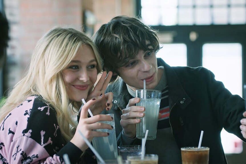 (l-r)  Lexy Cross (Alyvia Alyn Lind) and Grant Collins (Jackson Kelly) sip on drinks and smile for a selfie in Chucky 302 -- “Let the Right One In”