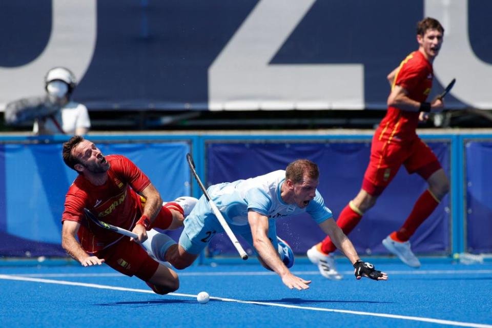 Lucas Rossi of Argentina and David Alegre of Spain tangle during a combustible game between the two nation.