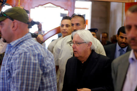 FILE PHOTO: U.N. envoy to Yemen Martin Griffiths is escorted by bodyguards during his departure at Sanaa airport in Sanaa, Yemen, June 5, 2018. REUTERS/Khaled Abdullah/File Photo