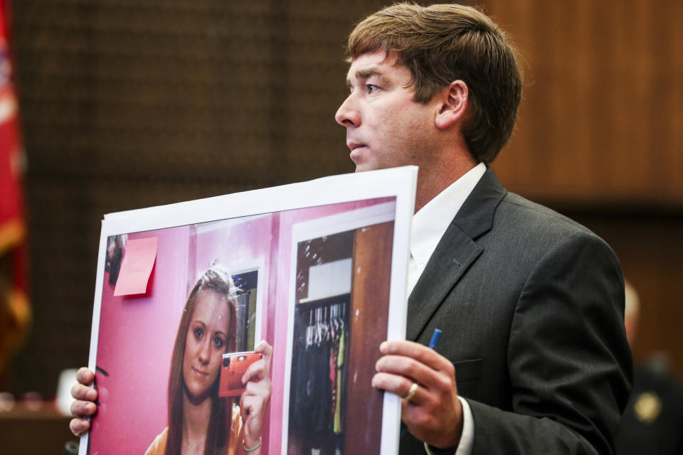 Deputy Prosecutor Jay Hale holds up a picture of Jessica Chambers on the first day of the retrial of Quinton Tellis in Batesville, Miss., Tuesday, Sept. 25 2018. Tellis is charged with burning 19-year-old Jessica Chambers to death almost three years ago on Dec. 6, 2014. Tellis has pleaded not guilty to the murder. (Brad Vest/The Commercial Appeal via AP, Pool)