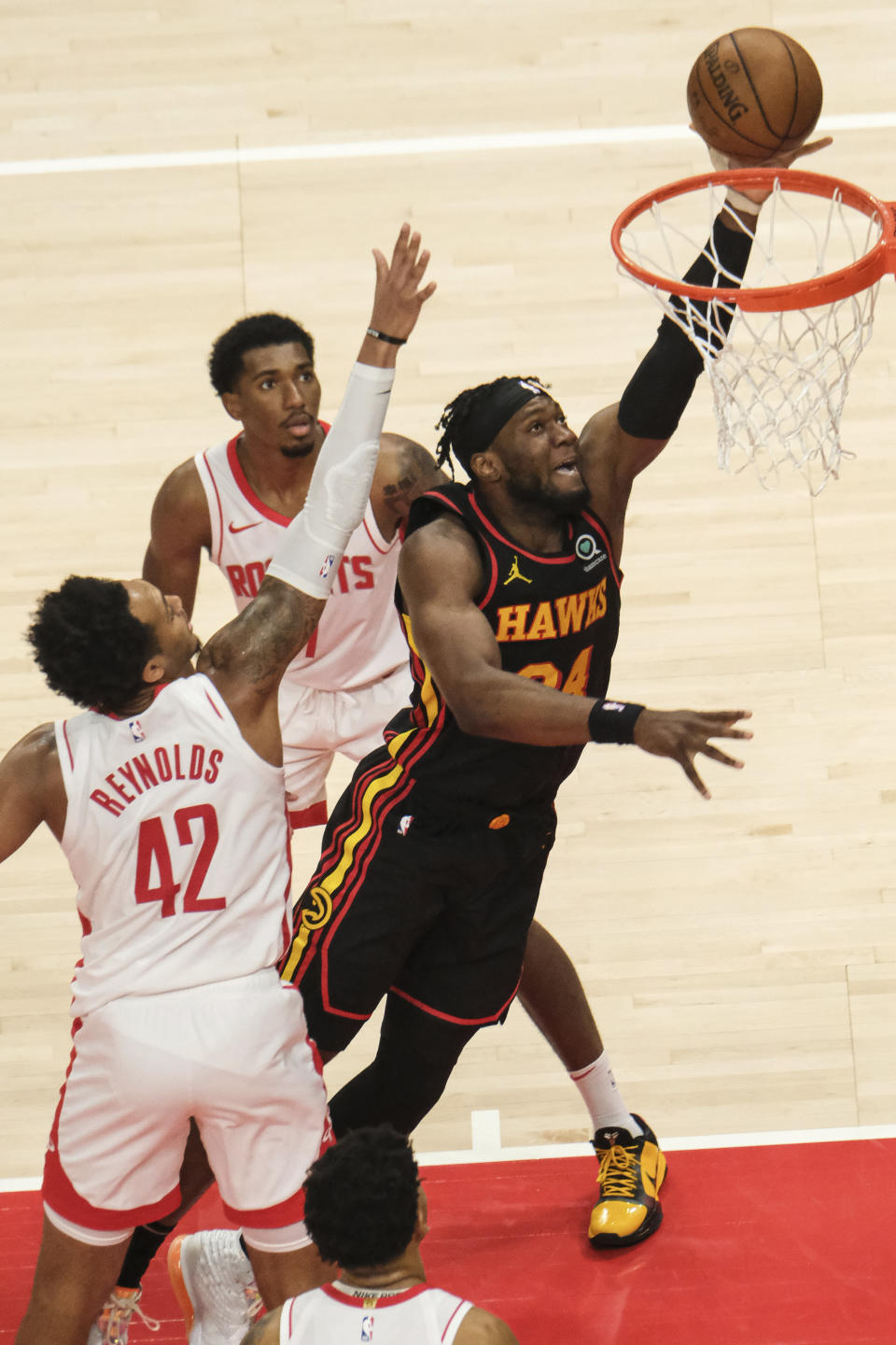 Atlanta Hawks forward Bruno Fernando (24) goes up for the slam against the Houston Rockets during the second half of an NBA basketball game on Sunday, May 16, 2021, in Atlanta. (AP Photo/Ben Gray)
