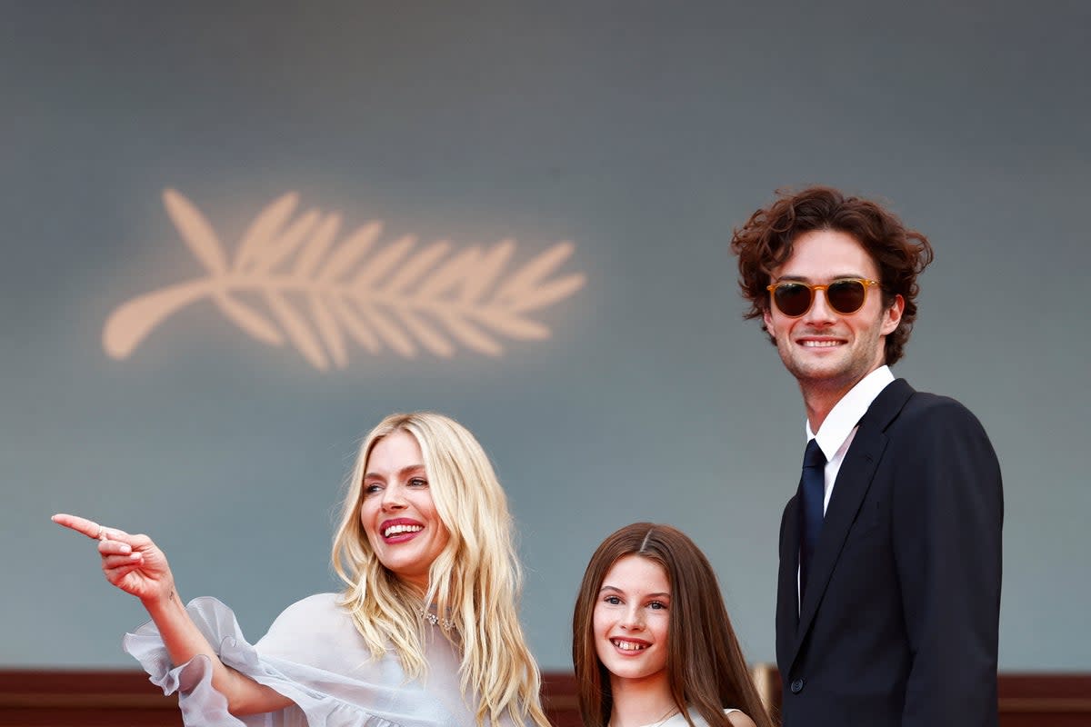 Sienna Miller, her daughter Marlowe and Oli Green (AFP via Getty Images)