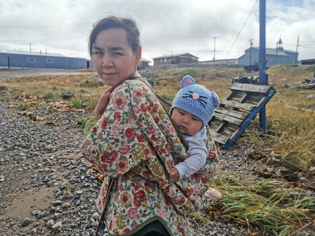 Arviat, Nunavut, resident Charlotte Karetak and her baby, Kuutsiq, who was born in Winnipeg.  (Kesha Karetak - image credit)