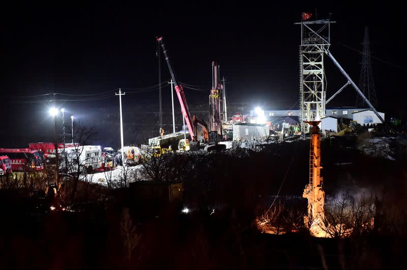 FILE PHOTO: Rescue teams work on saving workers trapped underground after an explosion at the gold mine under construction in Qixia