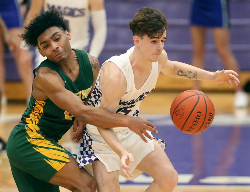 Firestone's Jemyrin Miller, left, strips the ball from Barberton's Tyler Schmidtt during the Falcons' 50-48 win Wednesday night. Miller made the game-winning shot with 4 seconds to go. [Phil Masturzo/Beacon Journal]