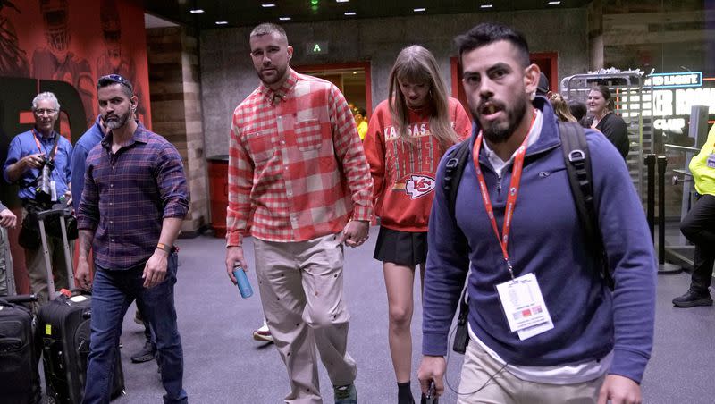 Kansas City Chiefs tight end Travis Kelce, center left, and singer Taylor Swift leave Arrowhead Stadium after an NFL football game between the Chiefs and the Los Angeles Chargers, Sunday, Oct. 22, 2023, in Kansas City, Mo.