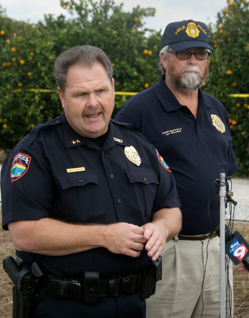 David Waller, right, who was then the FDLE's Lakeland field office resident agent in charge, appears with then Winter Haven Police Chief Gary Hester, left, at a press conference in 2010 after a body was found in an orange grove east of Winter Haven.