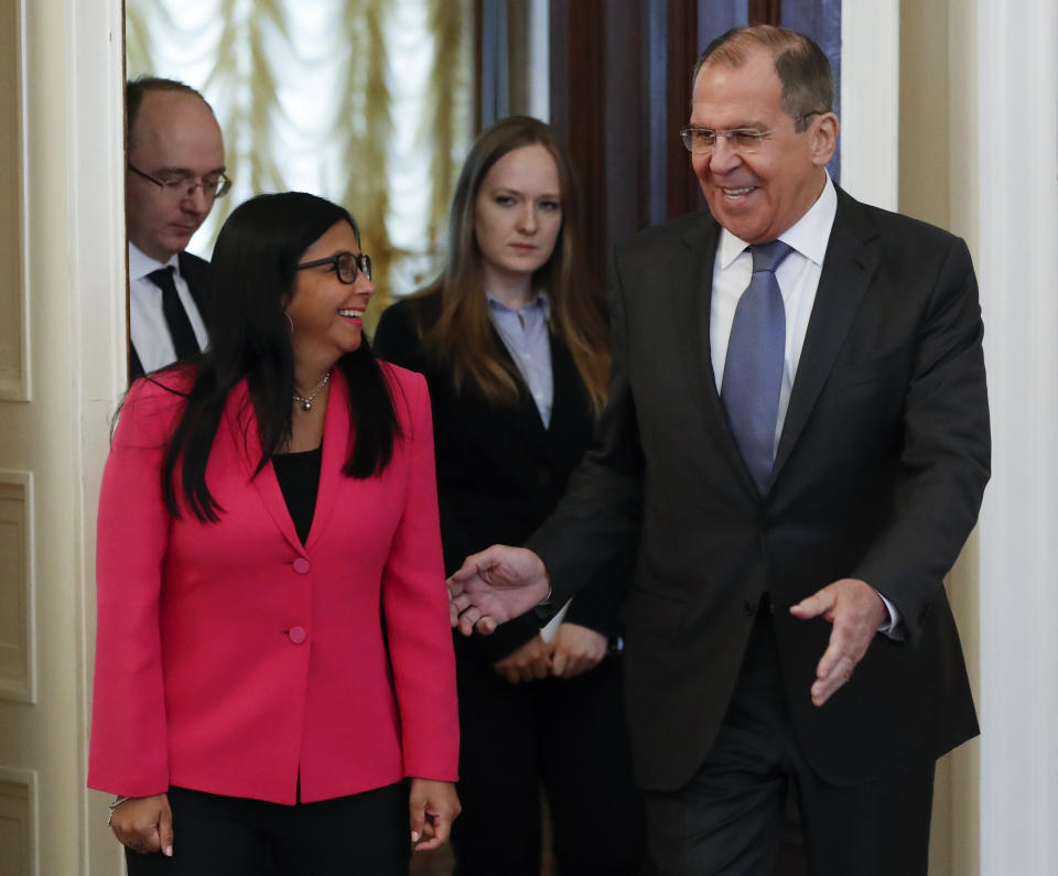 Russian Foreign Minister Sergey Lavrov, right, welcomes Venezuela's Vice President Delcy Rodriguez for talks in Moscow, Russia, Friday, March 1, 2019. (AP Photo/Pavel Golovkin)