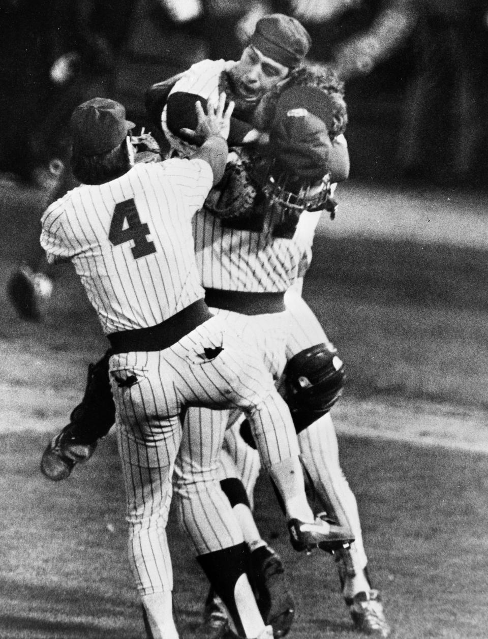 Catcher Ted Simmons and third baseman Paul Molitor celebrate with closer Pete Ladd after the Milwaukee Brewers defeated the California Angels, 4-3, to reach the 1982 World Series.
