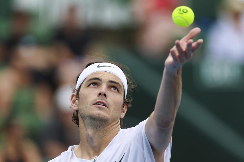 United States' Taylor Fritz serves to Australia's Alexei Popyrin during their match at the Kooyong Classic in Melbourne, Australia, Thursday, Jan. 12, 2023. (AP Photo/Asanka Brendon Ratnayake)