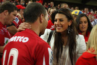 Quade Cooper of the Reds embraces his girlfriend, Australian Olympic swimmer Stephanie Rice after winning the 2011 Super Rugby Grand Final match between the Reds and the Crusaders at Suncorp Stadium on July 9, 2011 in Brisbane, Australia. (Photo by Cameron Spencer/Getty Images)