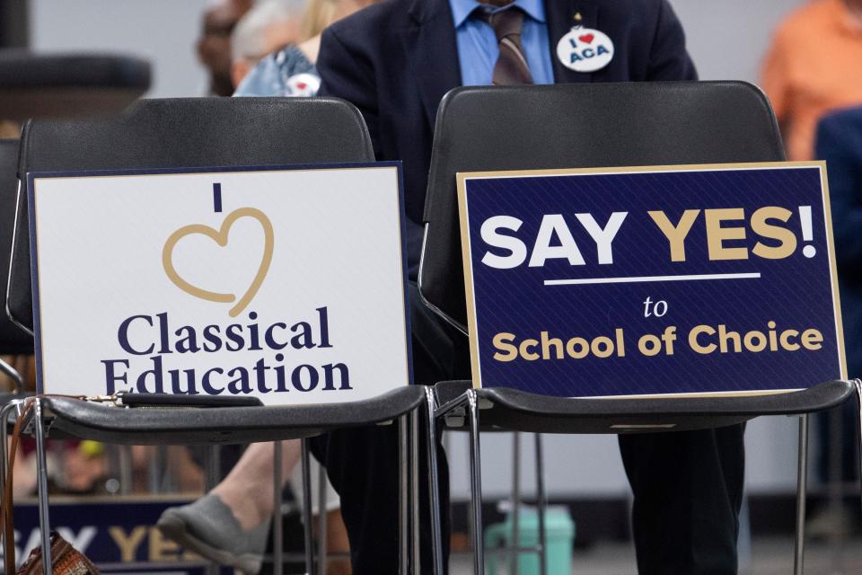 Signs in favor of ACA can be seen during the public comment portion of the American Classical Academy Madison County Charter School Appeal Public Hearing on Thursday, September 15, 2022, in Jackson, Tenn. 