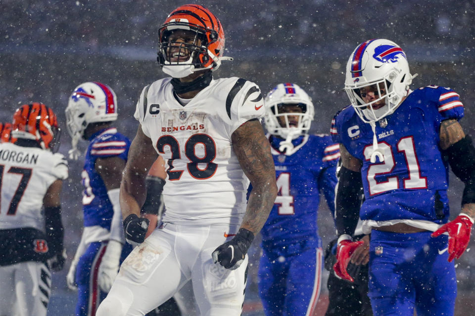 Cincinnati Bengals running back Joe Mixon (28) reacts after carrying the ball against the Buffalo Bills during the third quarter of an NFL division round football game, Sunday, Jan. 22, 2023, in Orchard Park, N.Y. (AP Photo/Joshua Bessex)