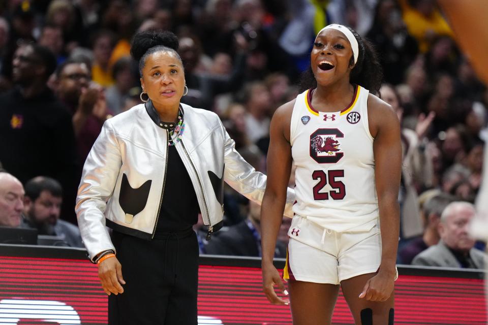 South Carolina head coach Dawn Staley, left, and guard Raven Johnson (25) react during the 2024 NCAA championship game against the Iowa Hawkeyes.