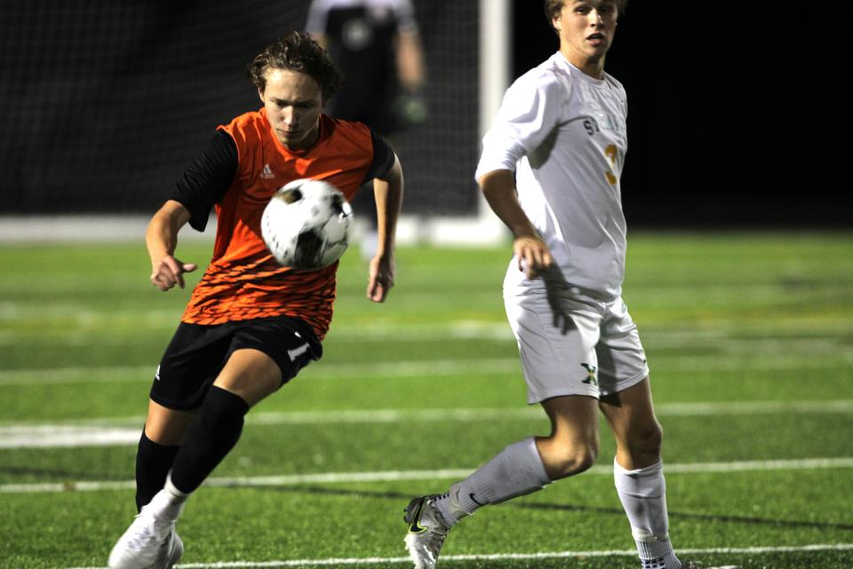 Ryle senior Jake McCann (7) plays the ball as Ryle and St. Xavier faced off in the KHSAA boys soccer state semifinals Oct. 25, 2023 at Lafayette High School, Lexington, Ky.