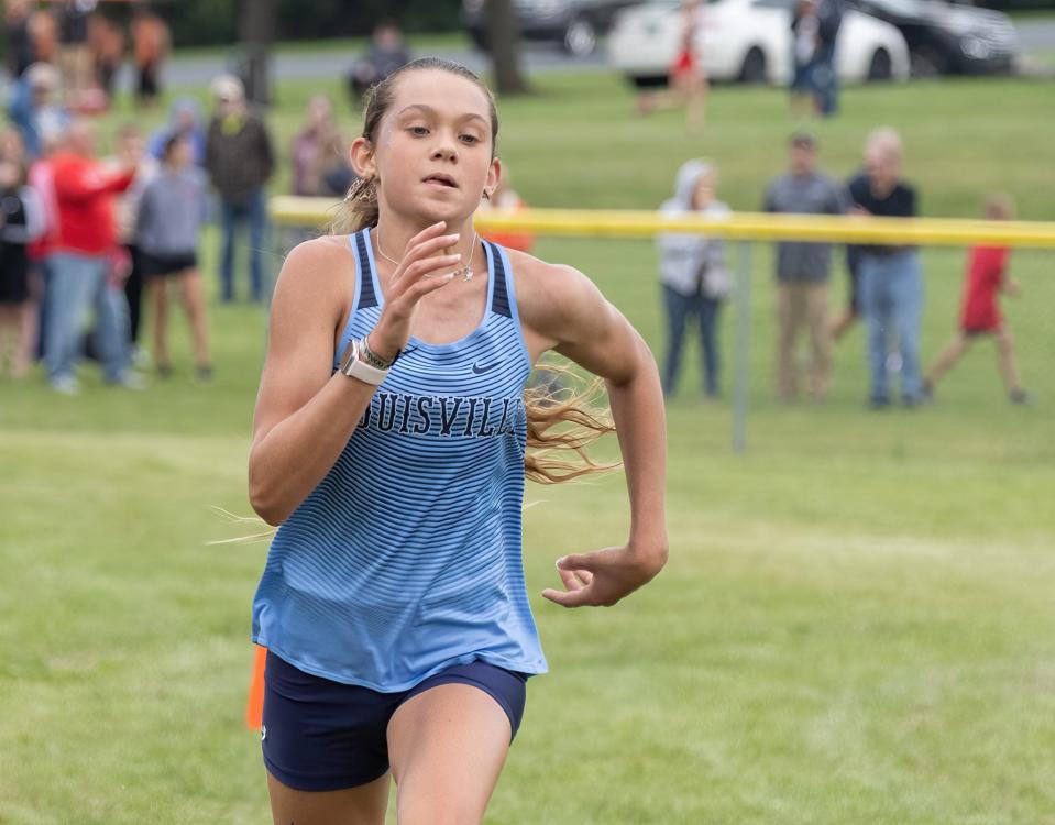 Louisville’s Kylah Meyer wins the girls big school division of the East Canton Cross Country Invitational, Wednesday, Aug. 30, 2023.