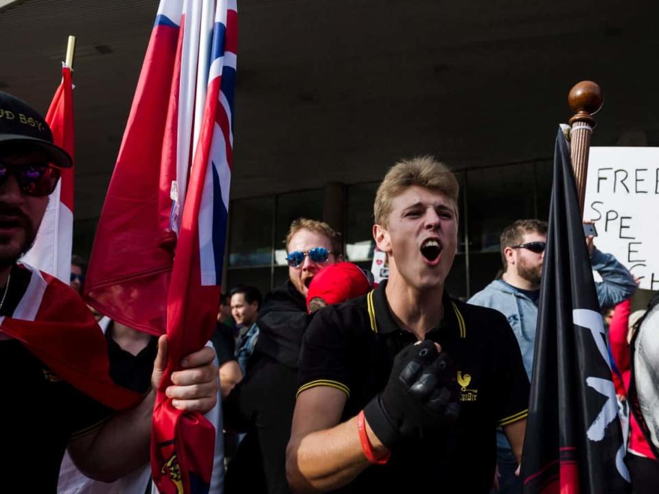 Members of the Proud Boys shout at a group of counter-protestors at Nathan Philips Square in Toronto on Saturday, October 21, 2017.  (Christopher Katsarov/The Canadian Press - image credit)