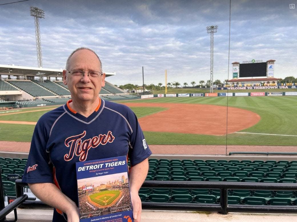 Roger Yoder of Jerome is pictured with a copy of his book, “Detroit Tigers: Michigan’s Favorite Sports Team,” at Joker Marchant Stadium in Lakeland, Fla., which is the Tigers' spring training home.