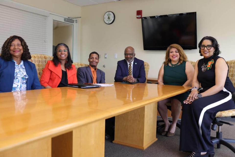 Gregory Gerami (third from left) poses for a photo with officials from Florida A&M University after announcing a historic $237 million donation to the school. After public skepticism about the wealth of the Texas hemp farm company CEO, officials have admitted the gift may be worthless, and Shawnta Friday-Stroud (second from left) resigned as vice president for university advancement.