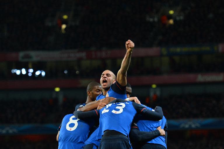 Monaco's Aymen Abdennour (C) celebrates during the giant killers' win over Arsenal in London on February 25, 2015