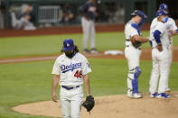 Los Angeles Dodgers starting pitcher Tony Gonsolin leaves the game during the fifth inning in Game 2 of a baseball National League Championship Series against the Atlanta Braves Tuesday, Oct. 13, 2020, in Arlington, Texas. (AP Photo/Eric Gay)