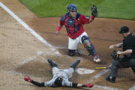 Chicago White Sox's Billy Hamilton, bottom, is tagged out by Minnesota Twins catcher Willians Astudillo, top, while trying to score from third on a triple in the fifth inning of a baseball game, Monday, May 17, 2021, in Minneapolis. (AP Photo/Jim Mone)