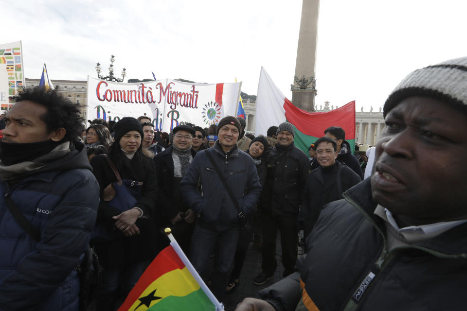 Migrants gather in St. Peter's Square to attend the Angelus noon prayer delivered by Pope Francis at the Vatican, Sunday, Jan.15, 2017. (AP Photo/Andrew Medichini)