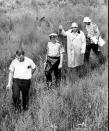 <p>Federal and state investigators probe the swampy area near Philadelphia, Miss., where the burned station wagon of the missing civil rights trio was found June 23, 1964. The civil rights workers, Michael Schwerner, 24, Andrew Goodman, 21, both white and James Chaney, 21, black, were last seen in Philadelphia, Miss., Sunday night, June 21, 1964. (Photo: AP) </p>