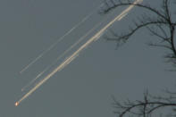 FILE - Debris from the space shuttle Columbia streaks across the Texas sky as seen from Dallas on Saturday, Feb. 1, 2003. NASA marked the 20th anniversary of the tragedy with somber ceremonies and remembrances during its annual tribute to fallen astronauts on Thursday, Jan. 26, 2023. (AP Photo/Jason Hutchinson/file)