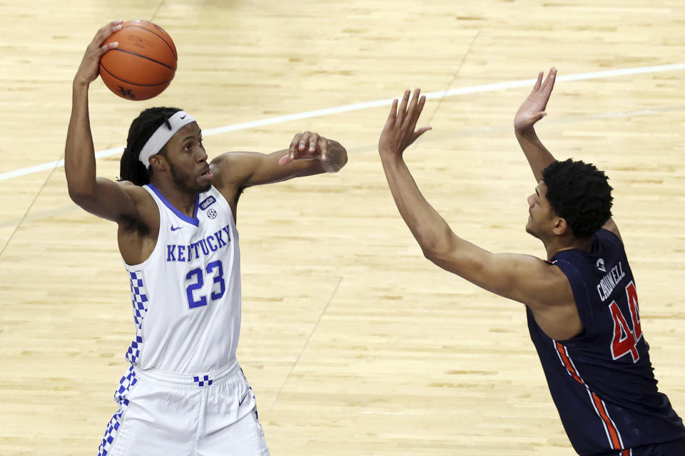 Kentucky's Isaiah Jackson (23) goes up for a dunk over Auburn's Dylan Cardwell during the second half of an NCAA college basketball game in Lexington, Ky., Saturday, Feb. 13, 2021. (AP Photo/James Crisp)
