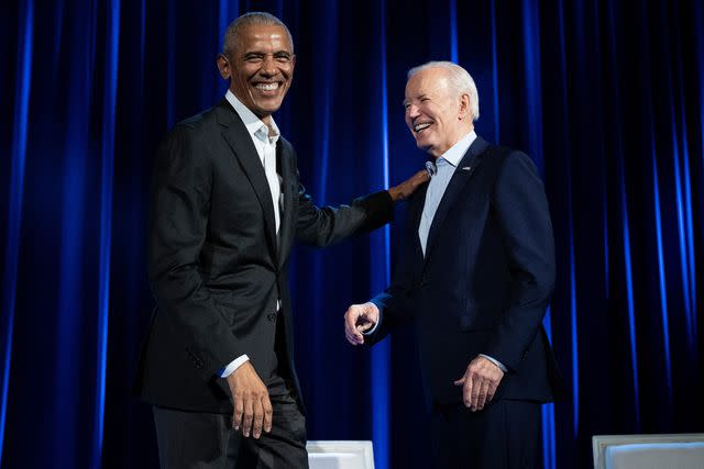 <p>BRENDAN SMIALOWSKI/AFP via Getty</p> Former President Barack Obama (left) and President Joe Biden