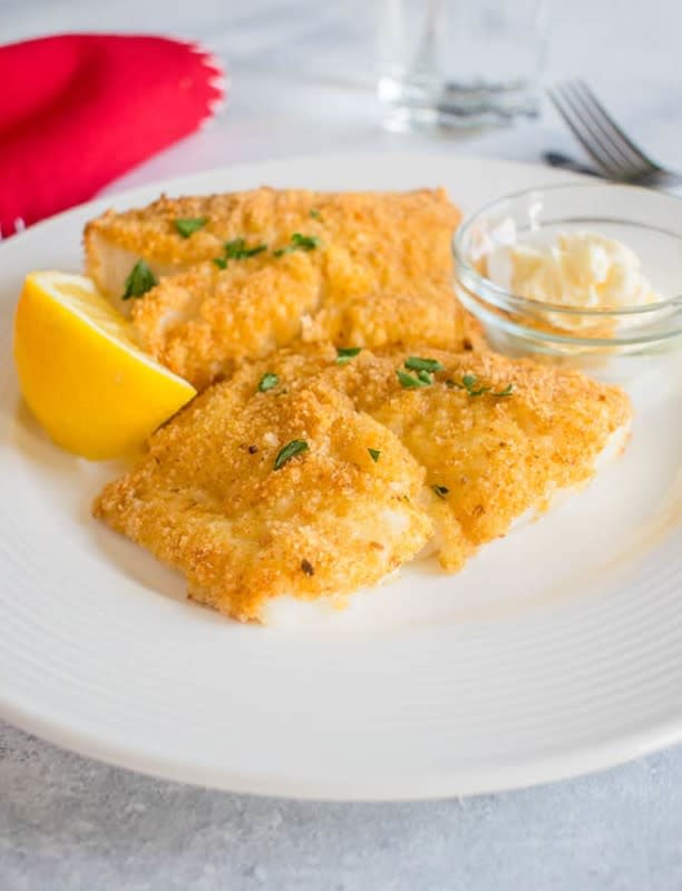<p>Cooking with Mammac</p><p>This oven-fried cod will become your go-to recipe! I tested it over and over to achieve the best, crispy, baked cod. Use this method for any oven-fried fish!</p><p><strong>Get the recipe: <a href="https://cookingwithmammac.com/oven-fried-cod/" rel="nofollow noopener" target="_blank" data-ylk="slk:Oven-Fried Cod;elm:context_link;itc:0;sec:content-canvas" class="link rapid-noclick-resp"><em>Oven-Fried Cod</em></a></strong></p>