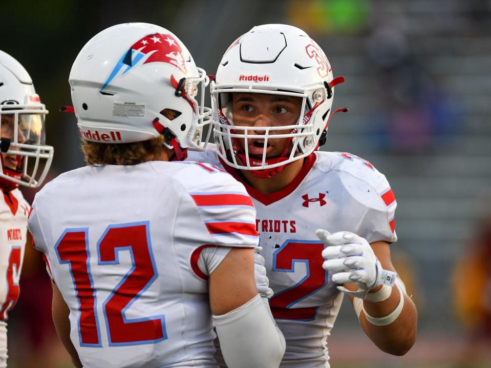 Lincoln's Gabe Gutierrez hypes up his teammates between plays during the first football game of the season on Friday, August 26, 2022, at Howard Wood Field in Sioux Falls.