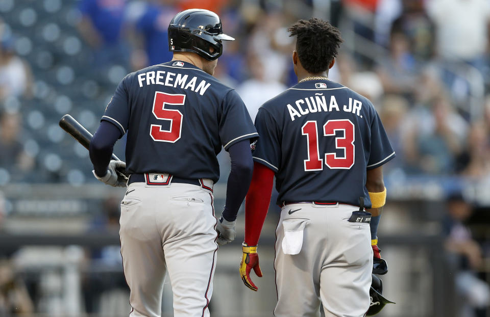 NEW YORK, NEW YORK - JUNE 21: (NEW YORK DAILIES OUT)  Freddie Freeman #5 and Ronald Acuna Jr. #13 of the Atlanta Braves in action against the New York Mets at Citi Field on June 21, 2021 in New York City. The Mets defeated the Braves 4-2. (Photo by Jim McIsaac/Getty Images)