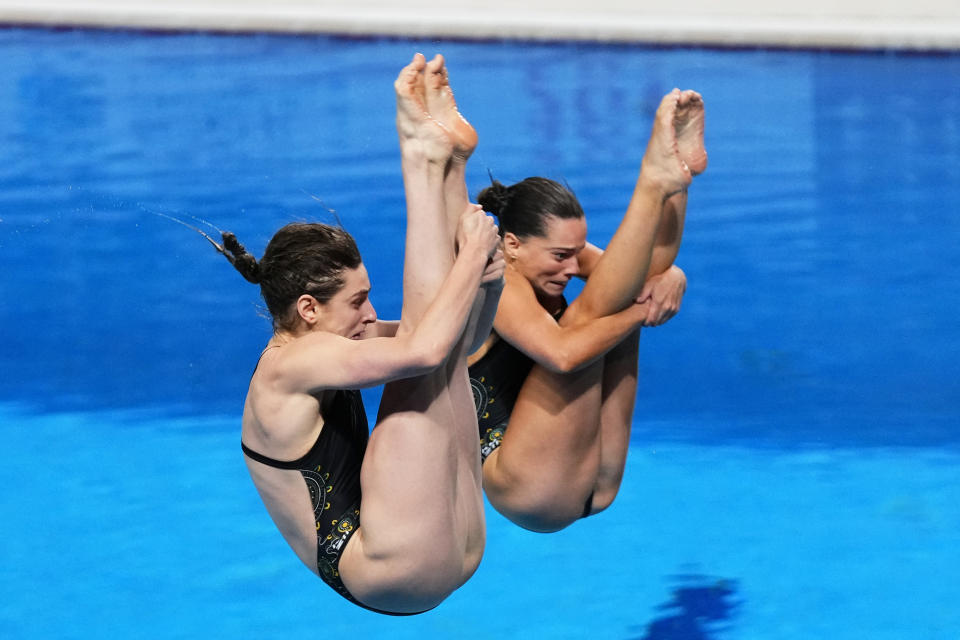 Annabelle Smith and Maddison Keeney of Australia compete during the women's synchronized 3m springboard diving final at the World Aquatics Championships in Doha, Qatar, Wednesday, Feb. 7, 2024. (AP Photo/Hassan Ammar)