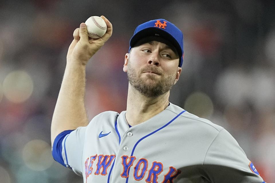 New York Mets starting pitcher Tylor Megill throws during the first inning of a baseball game against the Houston Astros Wednesday, June 21, 2023, in Houston. (AP Photo/David J. Phillip)