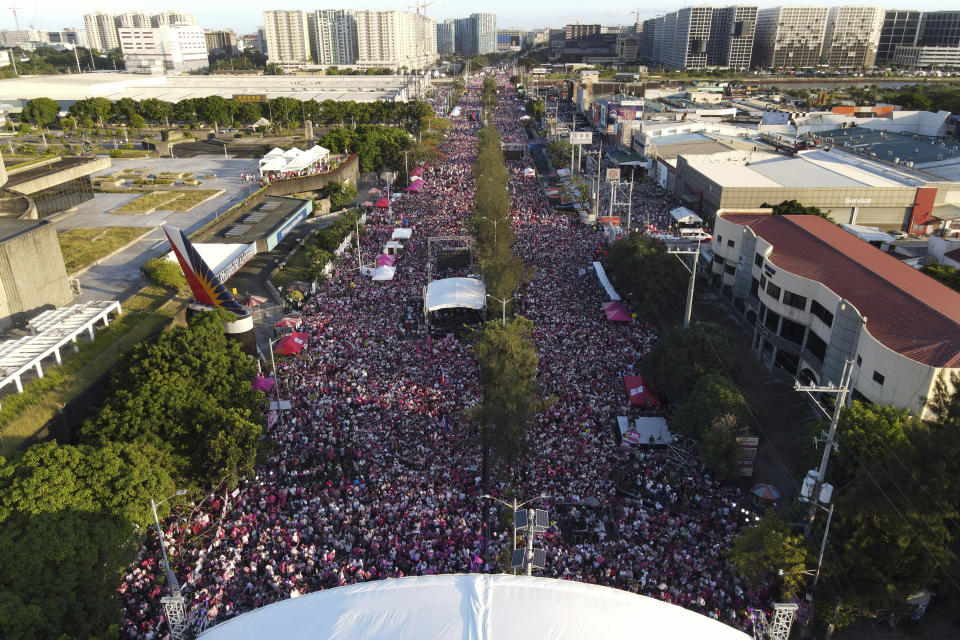 A giant crowd gathers during the presidential campaign rally of Vice President Leni Robredo who is also celebrating her 57th birthday in Pasay City, Philippines on April 23, 2022. The winner of May 9, Monday's vote will inherit a sagging economy, poverty and deep divisions, as well as calls to prosecute outgoing leader Rodrigo Duterte for thousands of deaths as part of a crackdown on illegal drugs. (AP Photo/Aaron Favila)