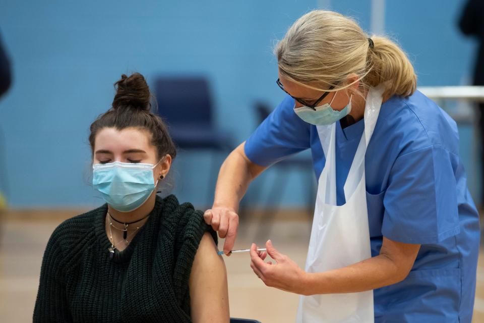 woman receiving covid vaccine