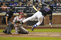 New York Mets' Taijuan Walker (99) falls after being hit by a pitch from Philadelphia Phillies pitcher Zack Wheeler during the third inning of a baseball game, Friday, Sept. 17, 2021, in New York. (AP Photo/Mary Altaffer)