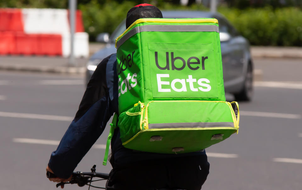 An Uber Eats food delivery courier delivers food in Bucharest, Romania.