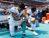 <p>Miami Dolphins Wide Receiver Kenny Stills (10), left, and Miami Dolphins Wide Receiver Albert Wilson (15) take a knee during the playing of the National Anthem prior to the start of the Miami Dolphins and Tennessee Titans game on Sunday, September 9, 2018 at Hard Rock Stadium in Miami Gardens, Fla. (Photo by Michele Sandberg/Icon Sportswire via Getty Images) </p>