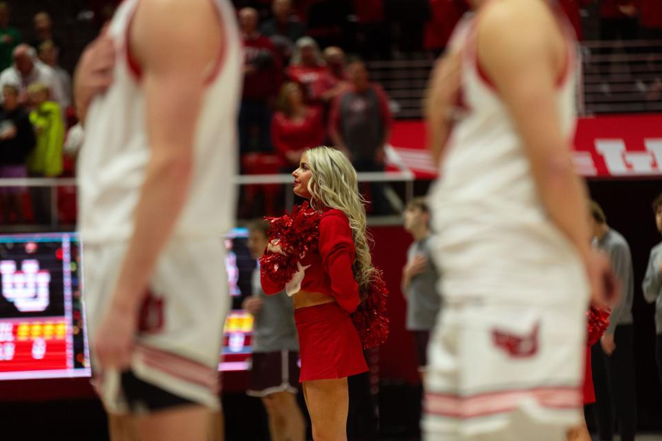 Utah Utes cheerleaders and basketball players put their hands over their hearts for the national anthem before the men’s college basketball game between the University of Utah and Bellarmine University at the Jon M. Huntsman Center in Salt Lake City on Wednesday, Dec. 20, 2023. | Megan Nielsen, Deseret News