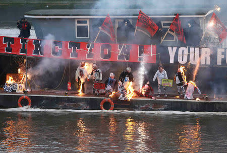 A collection of punk memorabilia belonging to Joe Corre, the son of Malcolm McLaren, the former manager of the Sex Pistols and fashion designer Vivienne Westwood, is burnt on a boat on the River Thames, in London, Britain November 26, 2016. REUTERS/Neil Hall