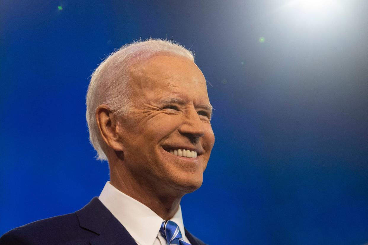 Democratic presidential primary candidate Vice President Joe Biden enters the debate stage Thursday, June 27, 2019, at the Adrienne Arsht Center for the Performing Arts in Miami. 