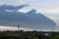 Smoke rises from a fire burning at the Intercontinental Terminals Company in Deer Park, east of Houston, Texas, U.S., March 18, 2019. REUTERS/Loren Elliott